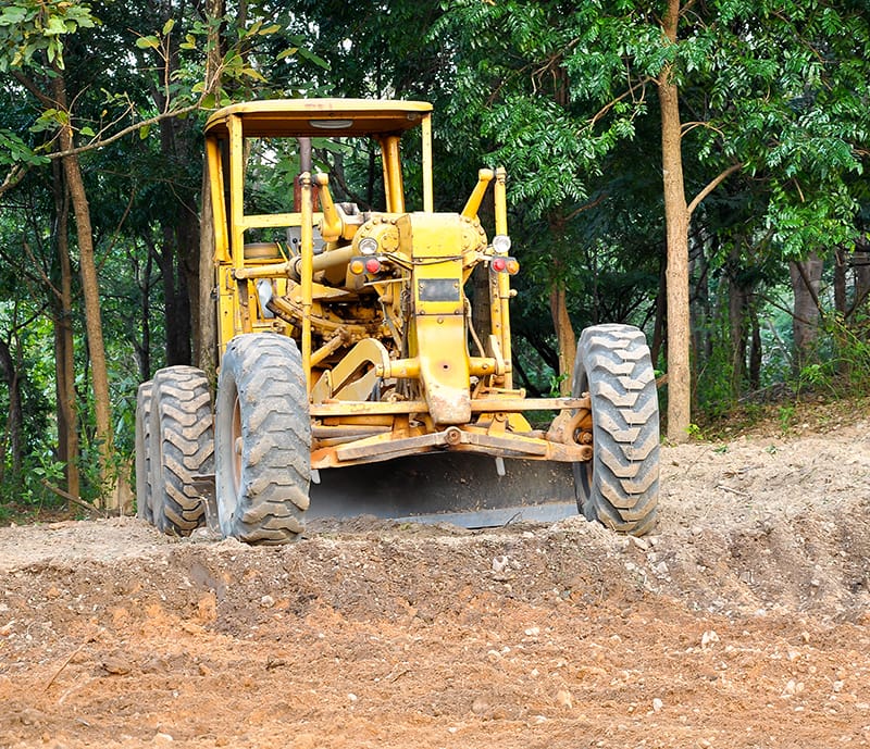 grader prepping a construction site